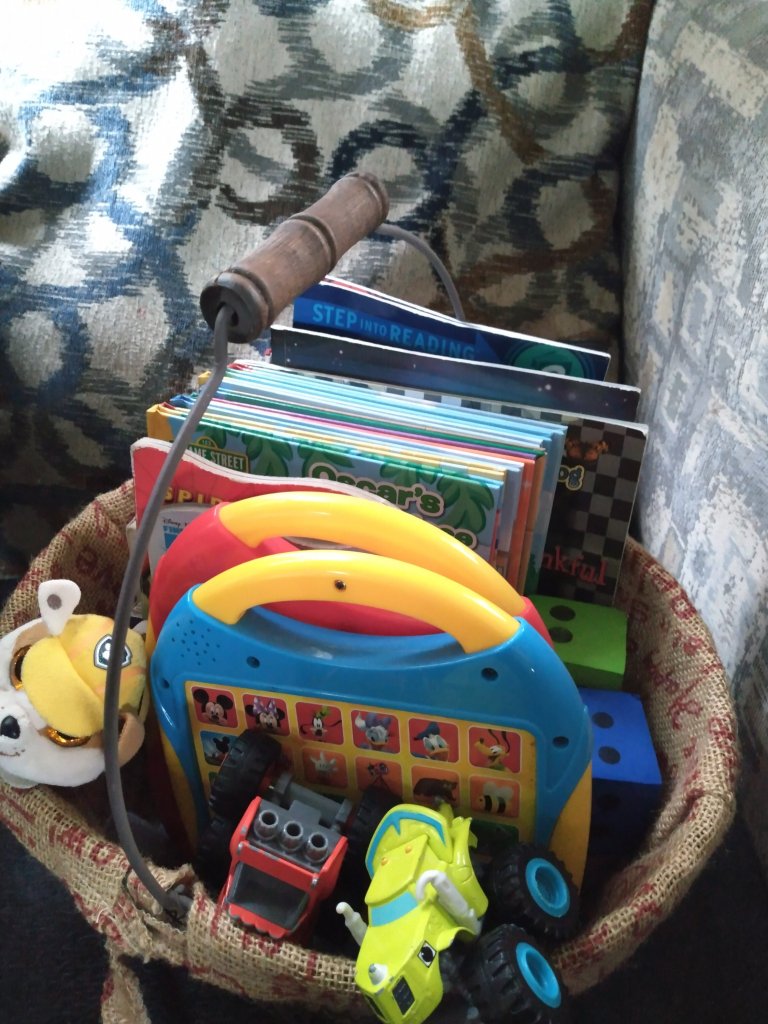 Basket of Books with Small Toys and Learning Pads